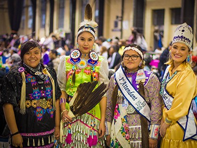 powwow dancers in traditional costumes